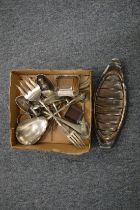 A small box of plated ware.