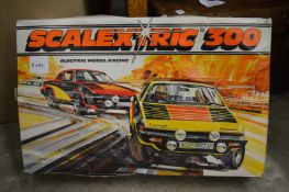 A Scalextric 300 boxed set (used) together with Hornby train accessories.