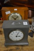A Walker & Hall pewter cased mantel clock and a walnut clock.