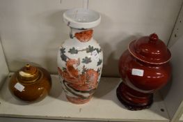 A Chinese vase and two Chinese glazed jars and covers.