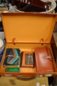 A leather briefcase, leather wallets, address books etc.