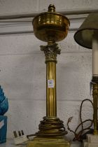 A brass corinthian column lamp.