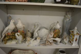 A collection of Lladro, Nao and other decorative china.