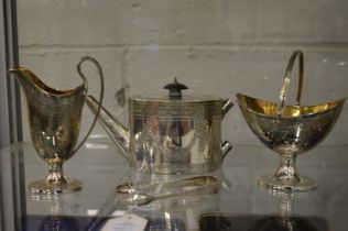 An early Victorian small silver teapot with pedestal sugar basin, helmet cream jug and a pair of