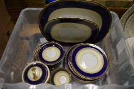 A quantity of Aynsley blue and gilt decorated dinnerware.