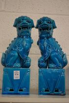 A pair of Chinese turquoise glazed lion dogs.