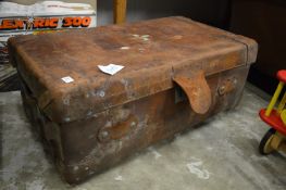 A large Finnigans leather trunk.