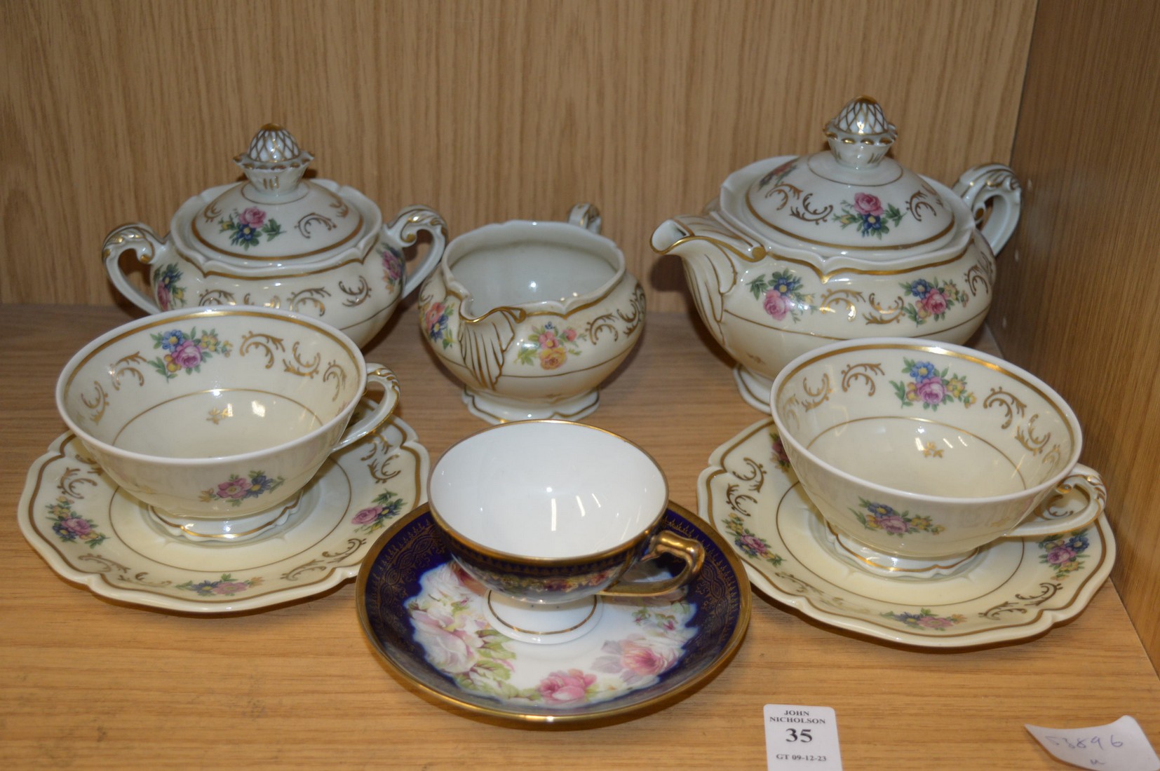 Floral decorated tea for two and a porcelain cup and saucer.