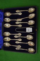 A cased set of twelve silver coffee spoons with sugar tongs.