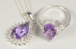 A silver amethyst and diamond pendant chain and ring in a box.