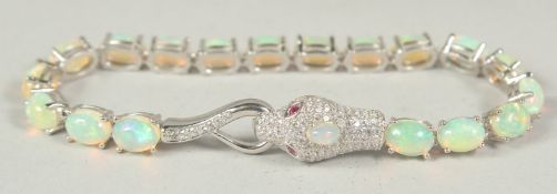 A silver real opal snake bracelet, in a velvet box.