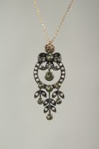 A 9ct. gold and silver peridot pearl and diamond necklace in a box.