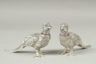 A pair of ruby collar pheasant salt and peppers, 11cm.