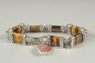 A Scottish silver tigers eye bracelet in a velvet box.