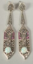 A pair of silver marcasite ruby and opal drop earrings in a box.