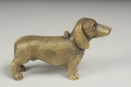 A brass and enamel dachshund vesta case.