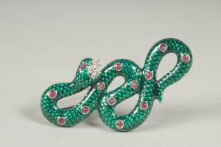 A silver ruby and enamel snake brooch or pendant in a box.
