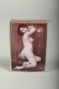 A silver plate snuff box with a nude.