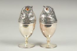 A pair of silver plate chick egg warmers.