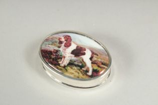 A small silver oval pill box, the lid with an enamel of a spaniel, 3.5cm.