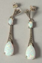 A good pair of silver Deco style opal drop earrings in a box.