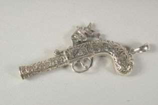 A novelty silver pistol whistle, 6cm.