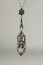A silver marcasite ruby and opal pendant and chain in a box.