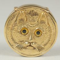 An 18ct. gold-plated, double-sided cat faced vesta box, 4cm diameter.
