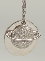 A silver plated pendant and chain in a box.