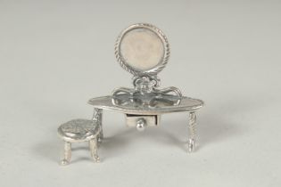 A miniature silver dressing table, 3cm.