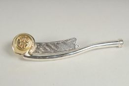 A silver gilt Bosons whistle.