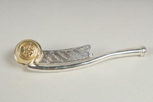 A silver gilt Bosons whistle.