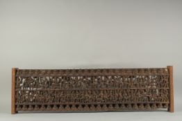 A FINE LARGE 19TH CENTURY SOUTH INDIAN CARVED WOODEN PANEL, carved with rows of dancers. 97.5cm x