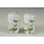 A PAIR OF JAPANESE PORCELAIN VASES, with floral decoration, each with blue mark to base, 11cm high.