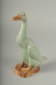 A CHINESE REPUBLIC PERIOD CELADON PORCELAIN FIGURE OF A DUCK, with impressed mark to base, 20.5cm
