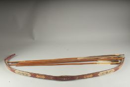 AN OTTOMAN TURKISH BOW WITH FIVE ARROWS.