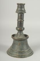 A 19TH CENTURY OTTOMAN BRASS CANDLESTICK, 28cm high.