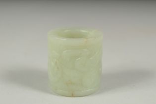 AN EARLY 20TH CENTURY CHINESE CARVED JADE RING, 3.5cm long.
