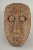 A FINE 19TH CENTURY AFRICAN CARVED WOODEN MASK, 27cm x 17cm.