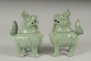 A PAIR OF CHINESE CELADON GLAZED PORCELAIN FIGURAL CENSER BURNERS, in the form of mythical beasts
