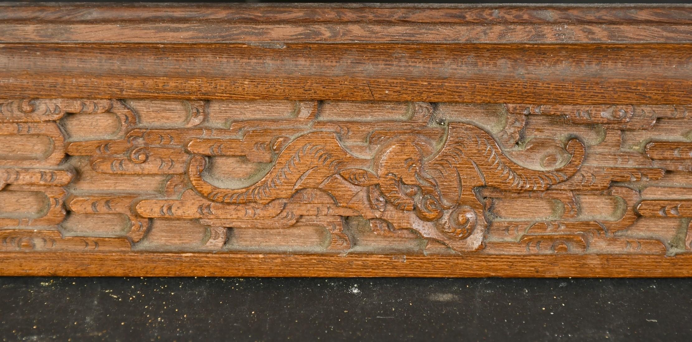 AN EARLY 20TH CENTURY CHINESE HARDWOOD FRAME, carved in an intricate design with bats and dragons, - Image 3 of 4