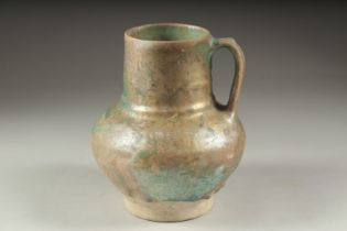 A RARE 12TH CENTURY PERSIAN KASHAN TURQUOISE GLAZED JUG, with traces of iridescence, 19cm high.