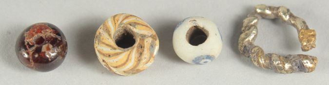 THREE BYZANTINE BEADS, together with a small white gold ring, (4).
