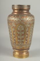 AN EYGPTIAN OR SYRIAN SILVER AND COPPER INLAID BRASS VASE, the shoulder with calligraphic band,