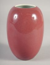 A CHINESE COPPER RED PORCELAIN POT, six-character mark to base, 15cm high.