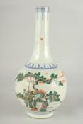 A CHINESE FAMILLE VERTE PORCELAIN BOTTLE VASE, painted with a scene of various figures, 32cm high.