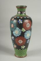 A BLACK GROUND CLOISONNE VASE, with decorative floral roundels and green scale pattern, 21.5cm