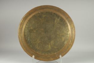 A LARGE SYRIAN DAMASCUS ENGRAVED CALLIGRAPHIC BRASS DISH, 48cm diameter.