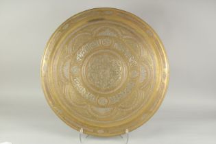 A LARGE ISLAMIC CAIROWARE SILVER AND COPPER INLAID BRASS TRAY, 61.5cm diameter.