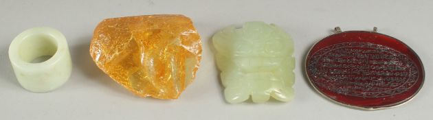 A MIXED LOT OF JADE, AMBER, AND INSCRIBED ISLAMIC PENDANT, (4).